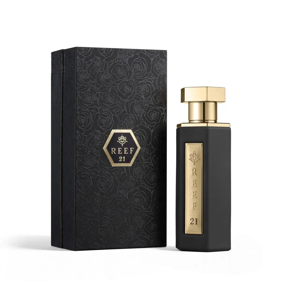 Perfume bottle and packaging with 'REEF 21' branding on a white background