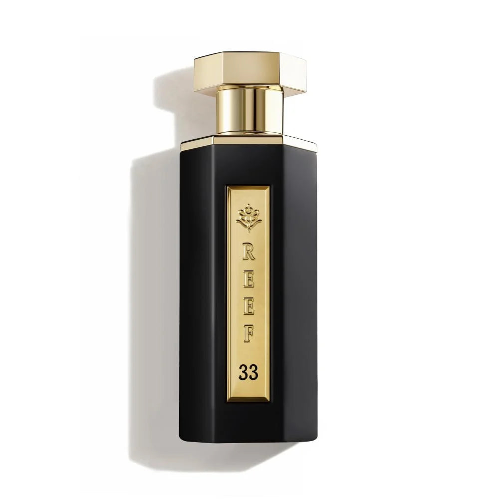Reef 33 100ml bottle with gold cap and label on a white background