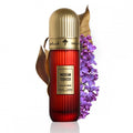 IBRAQ - Mexican Tobacco 100ml Extrait. Red perfume bottle with gold cap and 'Mexican Tobacco' label, surrounded by purple flowers on a white background.