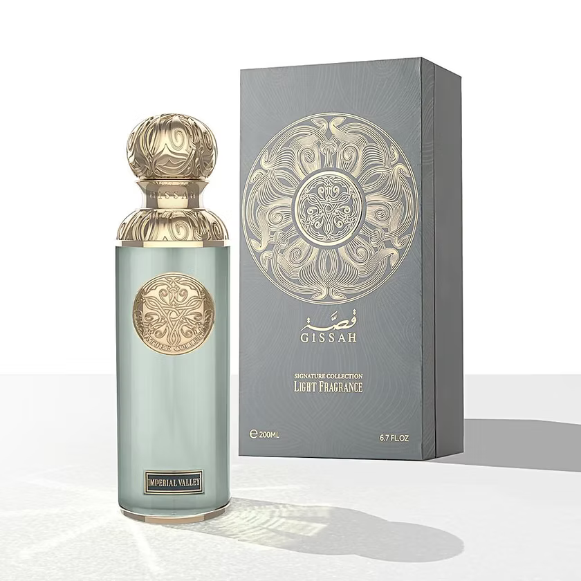 Gissah Imperial Valley 200ml perfume bottle with gold cap and intricate design next to its packaging on a white background