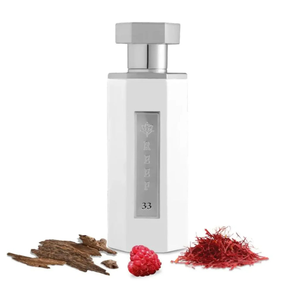 Reef 33 White 100ml bottle with silver cap on a white background, accompanied by saffron and other ingredients.